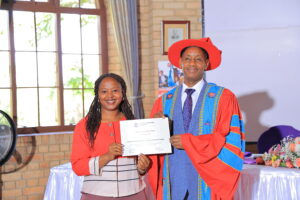 Graduate receives Certificate in Administrative Law from Uganda Christian University Vice Chancellor Prof. Aaron Mushengyezi at Mukono graduation
